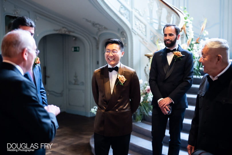 Groom looking nervous before wedding photographed at Savile Club in Mayfair, London