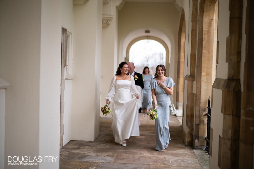 Wedding photographer - bride and bridesmaids in front of Dulwich church