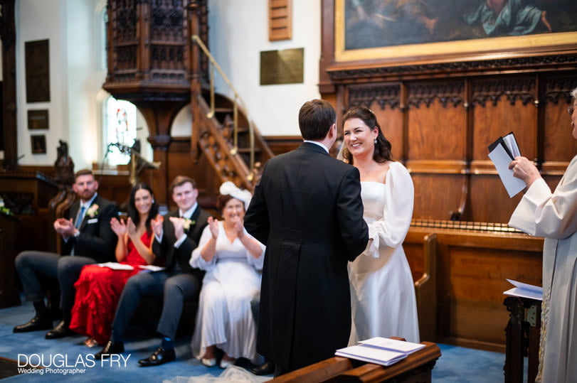 Wedding photographer - couple during service at Dulwich church