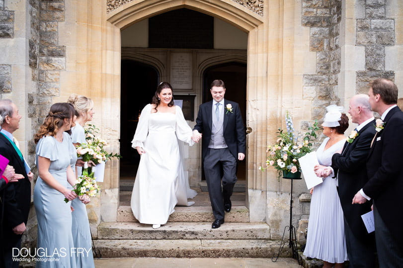 Wedding photographer - bride and groom leaving Dulwich church