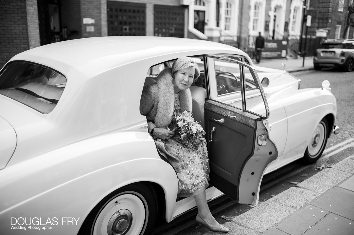 Wedding Photography at Chelsea Register Office and Then at London Home 5 Chelsea Register Office photography by Douglas Fry of bride arriving by Rolls Royce on King's Road in London