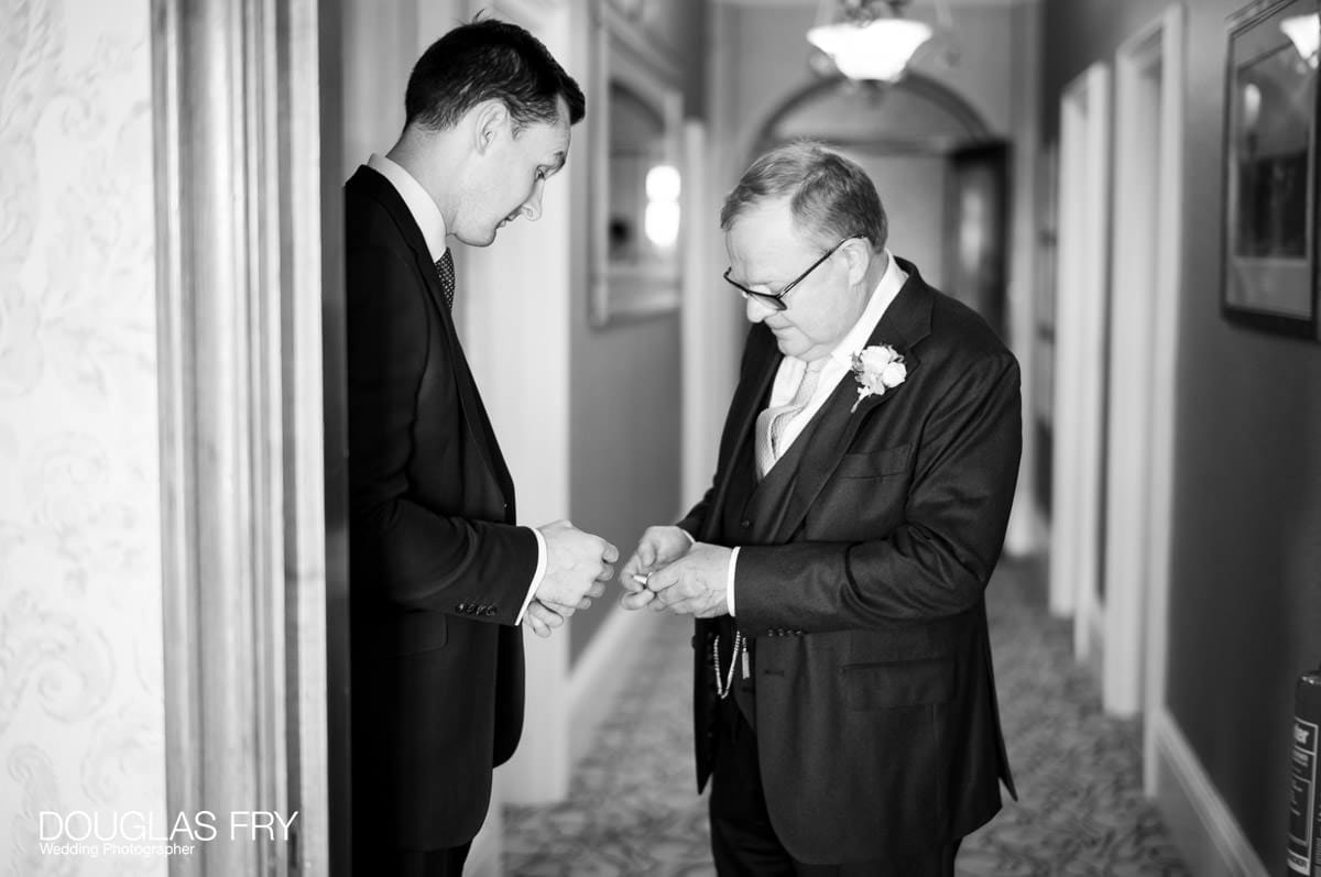 The groom photographed getting ready at the Petersham Hotel.