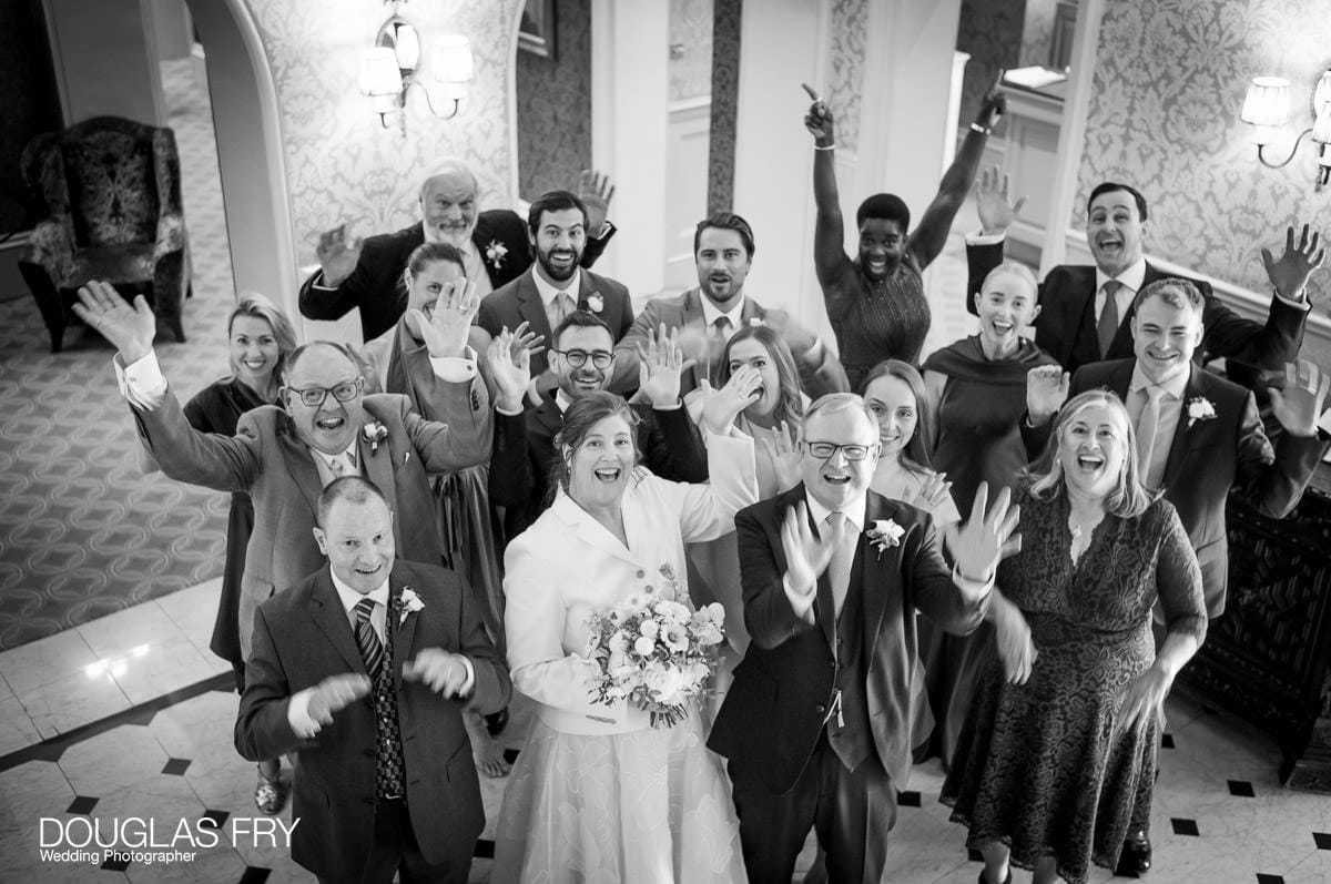 Group photograph by Douglas Fry at wedding at Petersham Hotel in Richmond London.